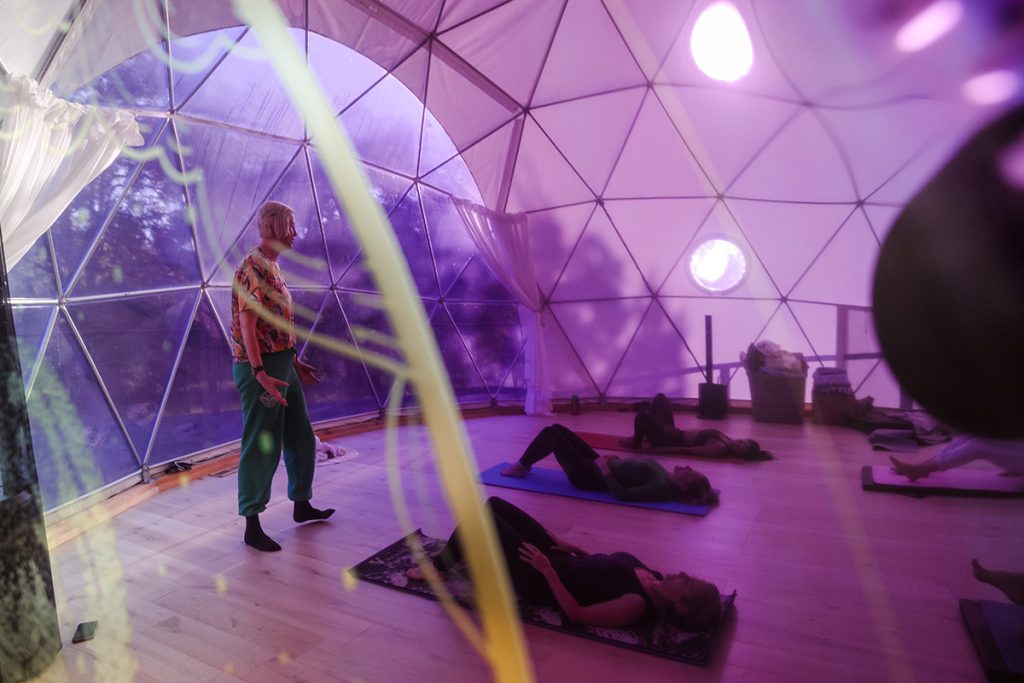 Photo by Lara Wiseman Daniel Photography of pilates in the Sound Dome at Wild Spark Retreat 2024